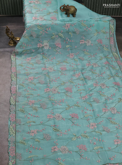 Tissue organza saree teal blue with allover floral embroidery and embroidery border
