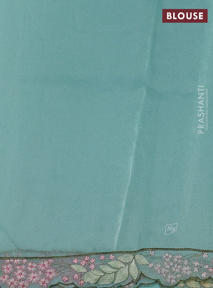 Tissue organza saree teal blue with allover floral embroidery and embroidery border