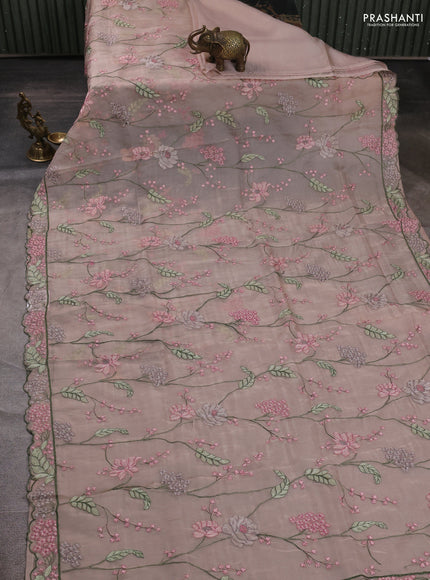 Tissue organza saree pastel pink shade with allover floral embroidery and embroidery border