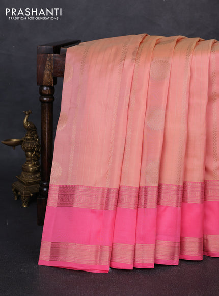 Kanchipuram silk saree pale orange and peach pink with allover zari weaves & buttas and long rettapet zari woven border