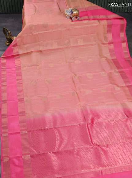 Kanchipuram silk saree pale orange and peach pink with allover zari weaves & buttas and long rettapet zari woven border