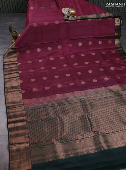 Kanchipuram silk saree magenta pink and bottle green with allover copper zari woven buttas and zari woven border