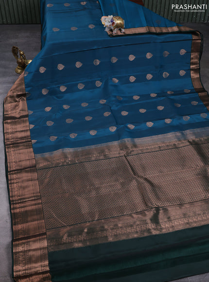 Kanchipuram silk saree peacock green and bottle green with copper zari woven buttas and copper zari woven border
