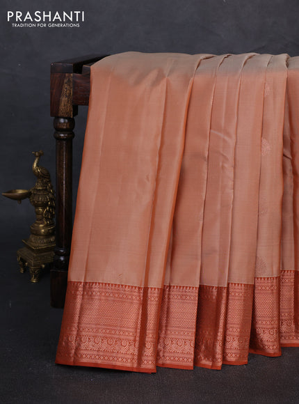 Kanchipuram silk saree sandal and rust shade with copper zari woven buttas and copper zari woven border