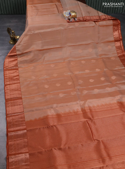 Kanchipuram silk saree sandal and rust shade with copper zari woven buttas and copper zari woven border