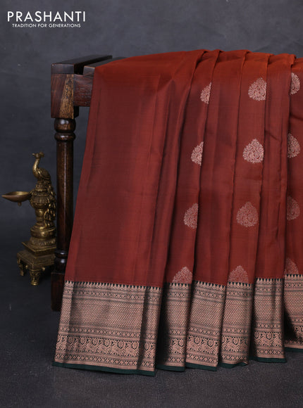 Kanchipuram silk saree rust shade and bottle green with copper zari woven buttas and copper zari woven border