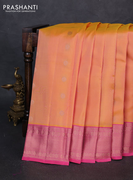 Kanchipuram silk saree dual shade of pinkish yellow and pink with allover copper zari woven buttas and zari woven border