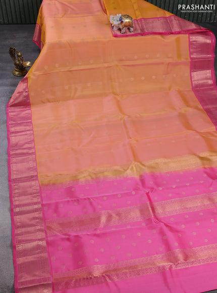 Kanchipuram silk saree dual shade of pinkish yellow and pink with allover copper zari woven buttas and zari woven border