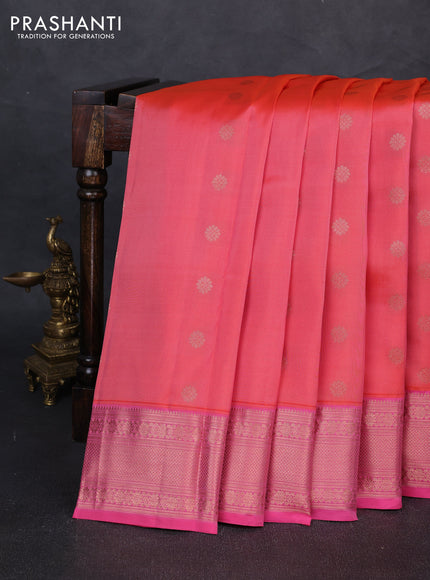 Kanchipuram silk saree peach orange and pink with allover copper zari woven buttas and copper zari woven border