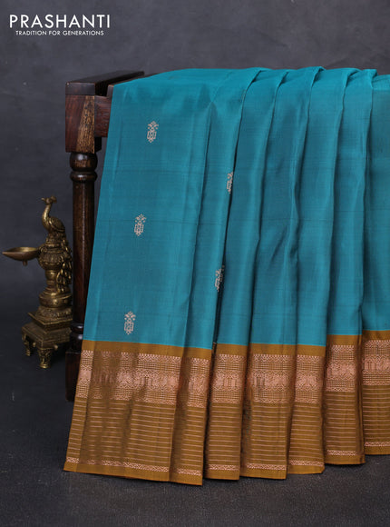 Kanchipuram silk saree green shade and mustard green with allover copper zari woven buttas and copper zari woven border