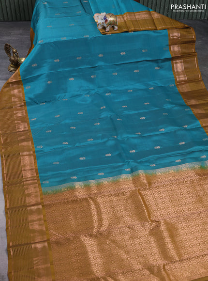 Kanchipuram silk saree green shade and mustard green with allover copper zari woven buttas and copper zari woven border