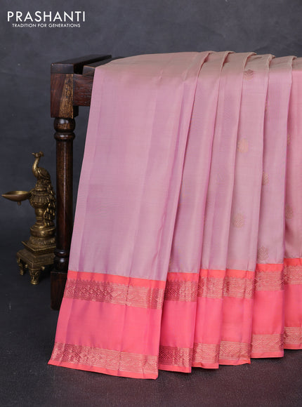Kanchipuram silk saree pastel pink and peach orange with allover copper zari woven buttas and rettapet copper zari woven border