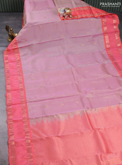 Kanchipuram silk saree pastel pink and peach orange with allover copper zari woven buttas and rettapet copper zari woven border
