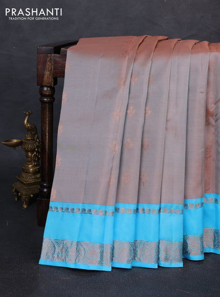 Kanchipuram silk saree dual shade of rust and light blue with copper zari woven buttas and rettapet copper zari woven border