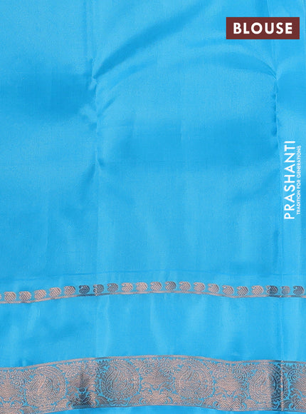 Kanchipuram silk saree dual shade of rust and light blue with copper zari woven buttas and rettapet copper zari woven border