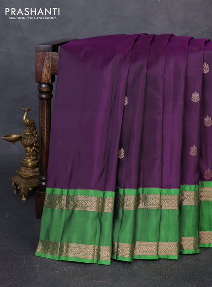 Kanchipuram silk saree deep purple and green with copper zari woven buttas and rettapet copper zari woven border