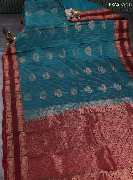 Kanchipuram silk saree peacock green and maroon with allover copper zari weaves & buttas and rettapet copper zari woven border