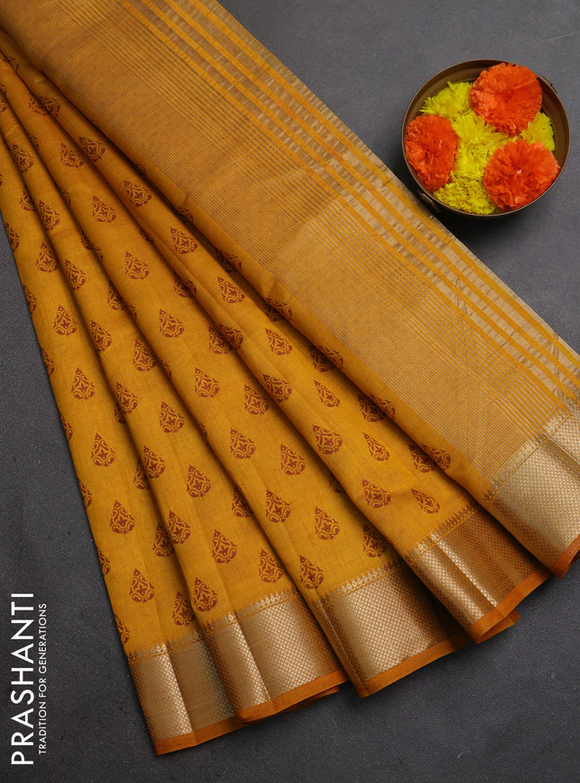 Semi raw silk saree dark mustard with allover butta prints and zari woven border