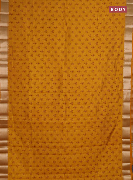 Semi raw silk saree dark mustard with allover butta prints and zari woven border