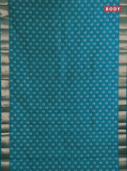 Semi raw silk saree teal green with allover butta prints and zari woven border