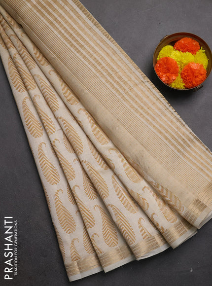 Semi raw silk saree cream with allover paisley butta prints and zari woven border