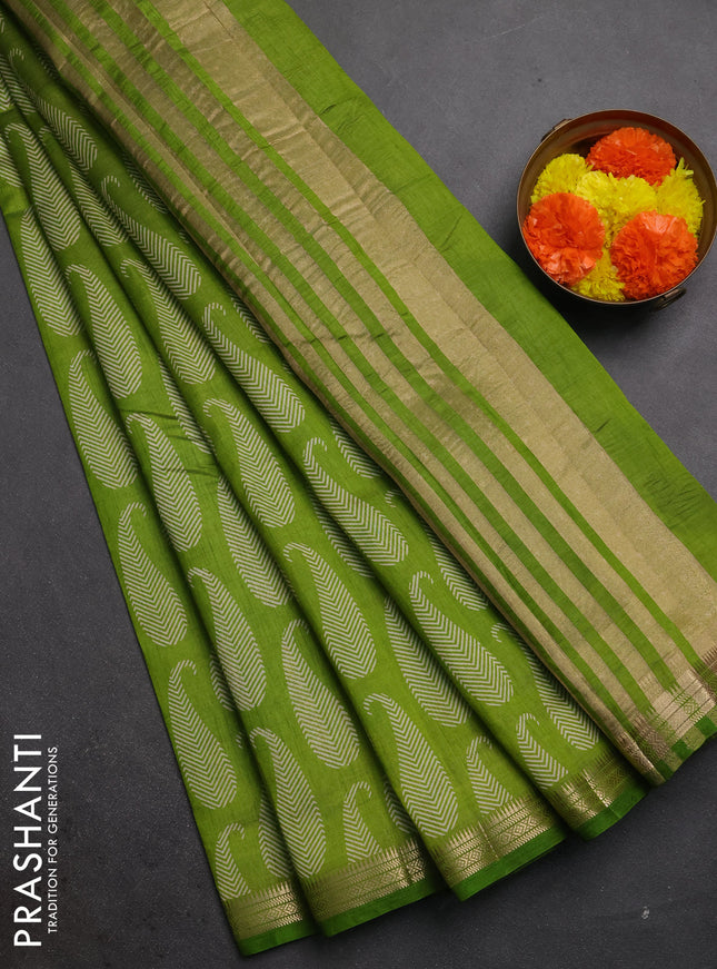Semi raw silk saree light green with allover paisley butta prints and zari woven border