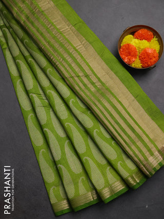 Semi raw silk saree light green with allover paisley butta prints and zari woven border