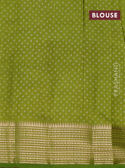 Semi raw silk saree light green with allover butta prints and temple design zari woven border
