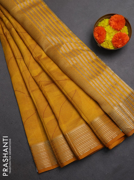Semi raw silk saree mustard yellow with allover butta prints and temple design zari woven border