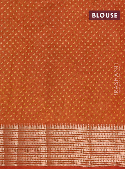 Semi raw silk saree rustic orange with allover butta prints and temple design zari woven border