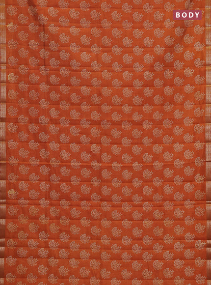 Semi raw silk saree rustic orange with allover floral butta prints and zari woven border