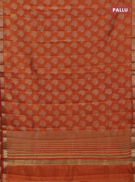 Semi raw silk saree rustic orange with allover floral butta prints and zari woven border