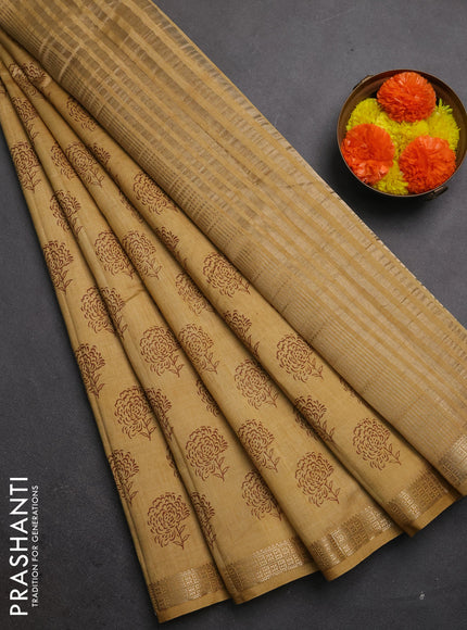 Semi raw silk saree sandal with allover floral butta prints and zari woven border