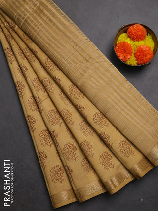 Semi raw silk saree sandal with allover floral butta prints and zari woven border