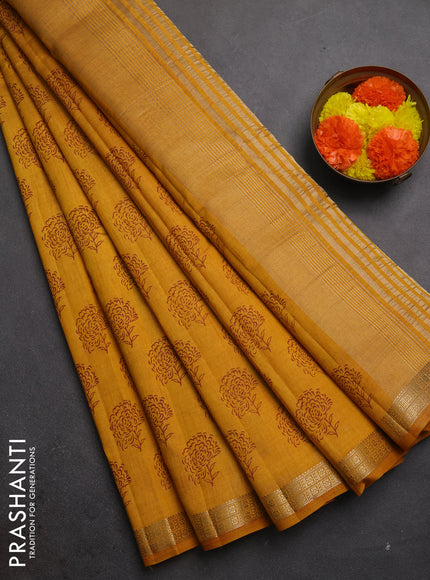 Semi raw silk saree dark mustard with allover floral butta prints and zari woven border