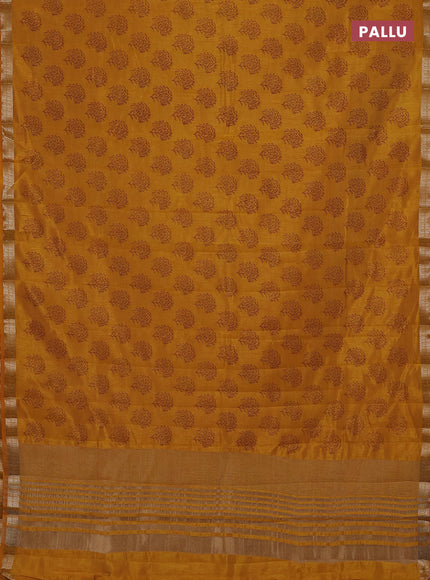 Semi raw silk saree dark mustard with allover floral butta prints and zari woven border