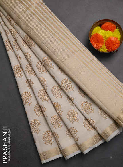 Semi raw silk saree cream with allover floral butta prints and zari woven border