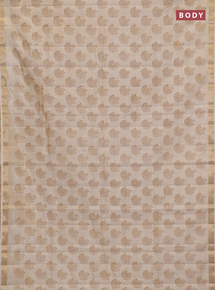 Semi raw silk saree cream with allover floral butta prints and zari woven border