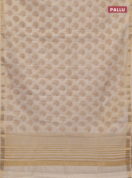 Semi raw silk saree cream with allover floral butta prints and zari woven border