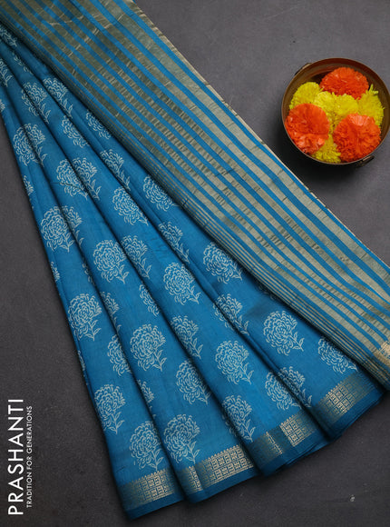 Semi raw silk saree teal blue with allover floral butta prints and zari woven border