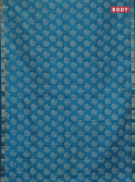Semi raw silk saree teal blue with allover floral butta prints and zari woven border