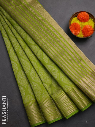 Semi raw silk saree light green with allover geometric butta prints and temple design zari woven border