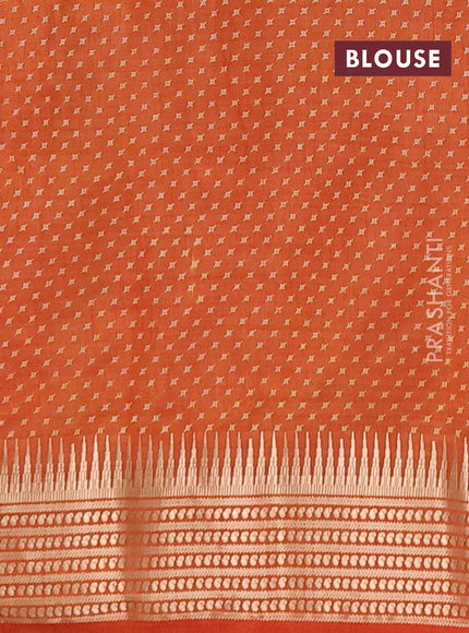 Semi raw silk saree rustic orange with allover geometric butta prints and temple design zari woven border