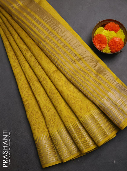 Semi raw silk saree mustard yellow with allover geometric butta prints and temple design zari woven border