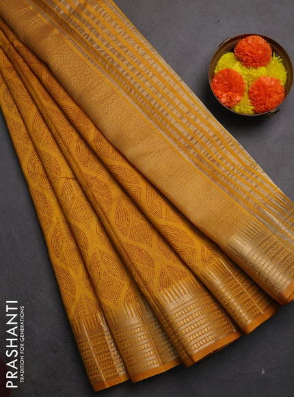 Semi raw silk saree dark mustard with allover geometric butta prints and temple design zari woven border