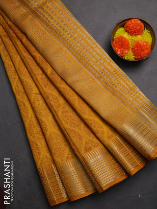 Semi raw silk saree dark mustard with allover geometric butta prints and temple design zari woven border