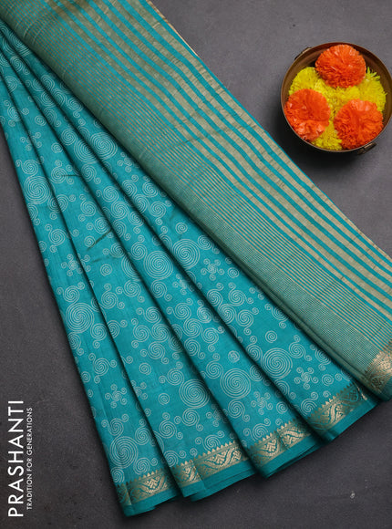 Semi raw silk saree teal green with allover geometric prints and zari woven border