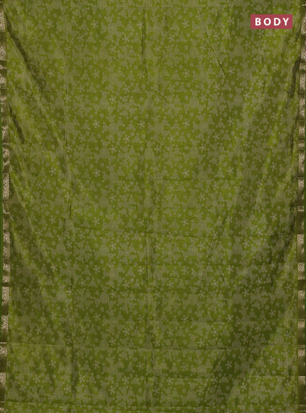 Semi raw silk saree light green with allover geometric prints and zari woven border