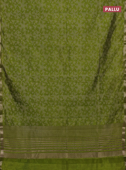 Semi raw silk saree light green with allover geometric prints and zari woven border