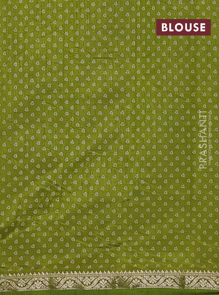 Semi raw silk saree light green with allover geometric prints and zari woven border